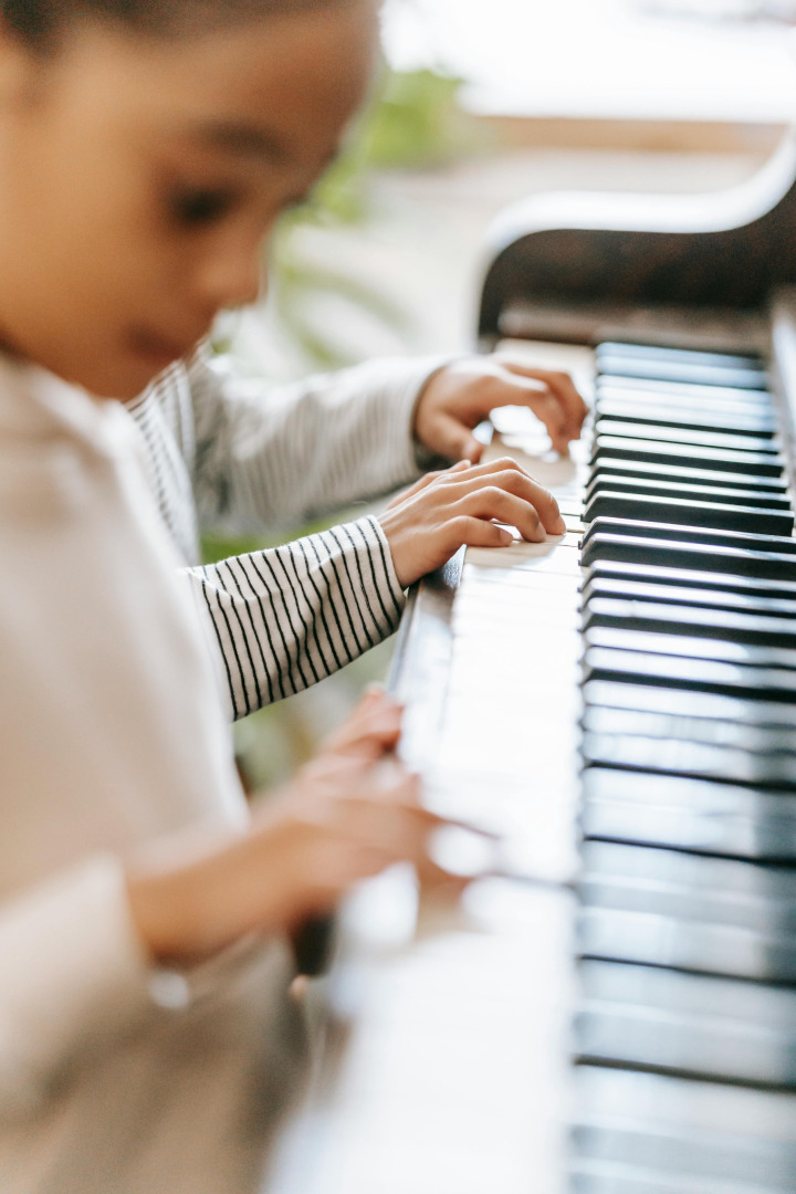 Piano student at keyboard – piano lessons in St. Catharines and Niagara